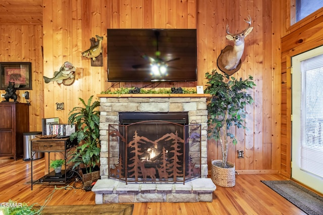 2210 Hawks Point Way, Sevierville, TN 37862 - details featuring wooden walls, a stone fireplace, and wood finished floors