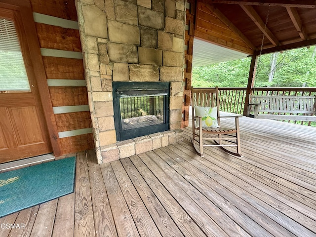 2575 Black Bear Ln, Sevierville, TN 37876 - deck with an outdoor stone fireplace