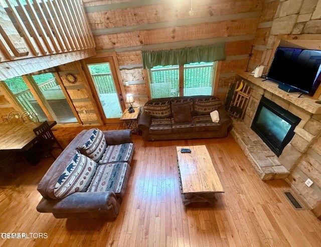 2575 Black Bear Ln, Sevierville, TN 37876 - living area featuring visible vents, a fireplace, and wood-type flooring