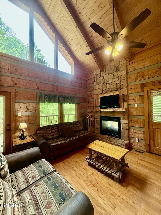 2575 Black Bear Ln, Sevierville, TN 37876 - living room with wood walls, high vaulted ceiling, and plenty of natural light