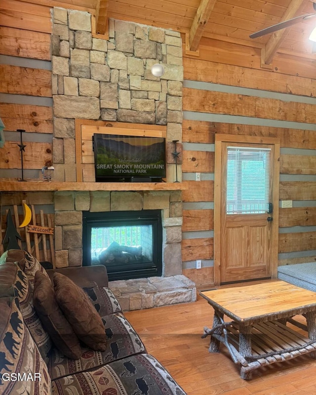 2575 Black Bear Ln, Sevierville, TN 37876 - living room with wood ceiling, wood walls, wood finished floors, and beamed ceiling