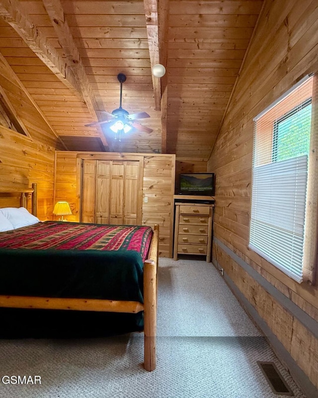 2575 Black Bear Ln, Sevierville, TN 37876 - bedroom featuring wood walls, visible vents, vaulted ceiling, wooden ceiling, and light carpet