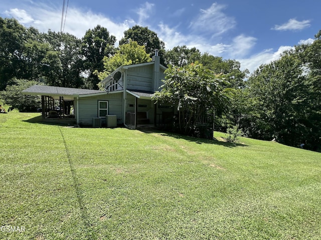 815 Hartsell Rd, Newport, TN 37821 - rear view of house with a lawn and view of scattered trees