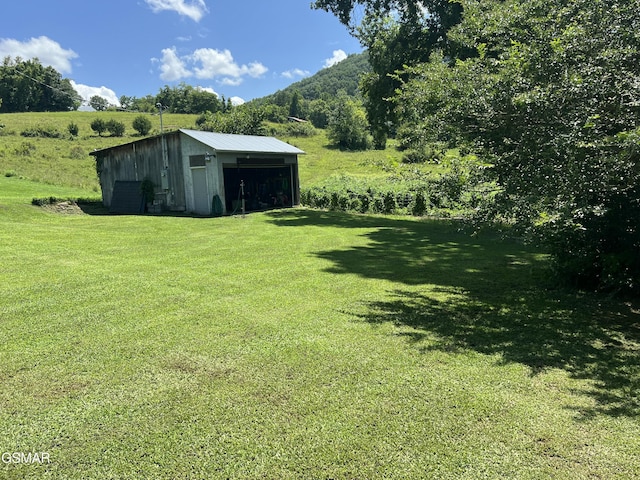 815 Hartsell Rd, Newport, TN 37821 - view of grassy yard with an outbuilding, an outdoor structure, and a detached garage