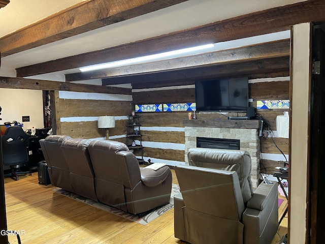 815 Hartsell Rd, Newport, TN 37821 - living area featuring light wood-type flooring, wooden walls, beam ceiling, and a fireplace