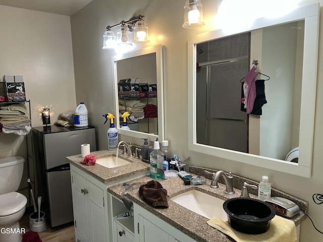 815 Hartsell Rd, Newport, TN 37821 - bathroom with double vanity, a shower stall, and wood finished floors