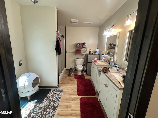 815 Hartsell Rd, Newport, TN 37821 - bathroom with wood finished floors, double vanity, and a shower stall