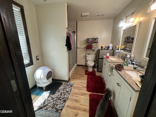 815 Hartsell Rd, Newport, TN 37821 - bathroom with wood finished floors, a shower stall, and double vanity