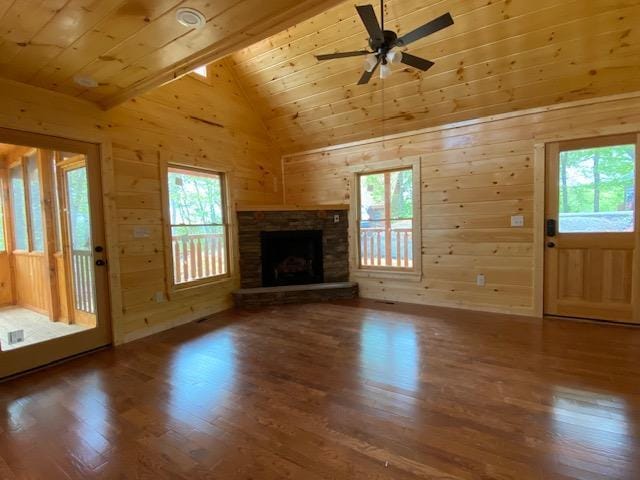 unfurnished living room featuring a fireplace, lofted ceiling with beams, hardwood / wood-style flooring, and wooden ceiling