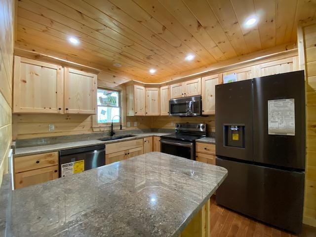 kitchen featuring sink, stainless steel appliances, dark stone countertops, light brown cabinetry, and wood ceiling