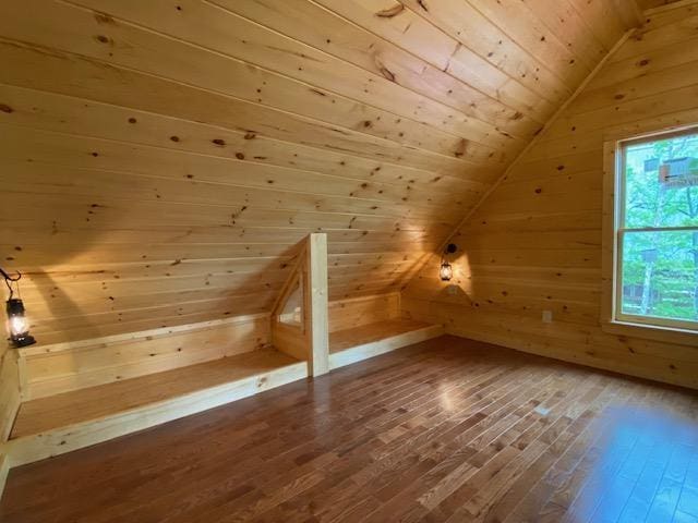 bonus room with wooden ceiling, wooden walls, a healthy amount of sunlight, and lofted ceiling