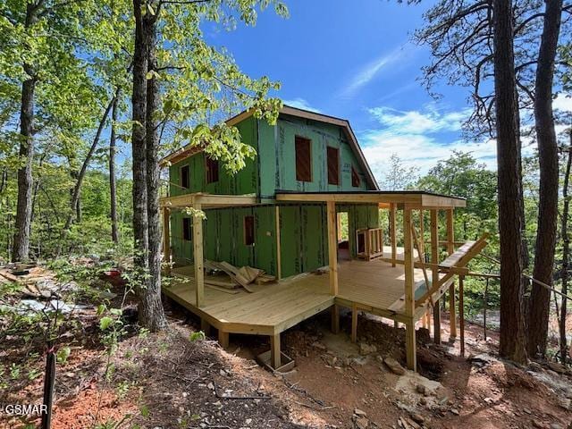 back of house featuring a deck