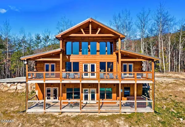 1010 Leslie Way, Sevierville, TN 37876 - rear view of property featuring french doors, log siding, a patio, and a view of trees