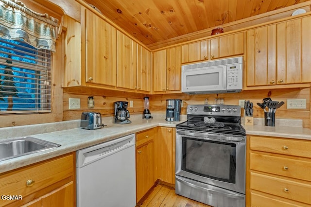 kitchen with white appliances, wood ceiling, and light hardwood / wood-style flooring