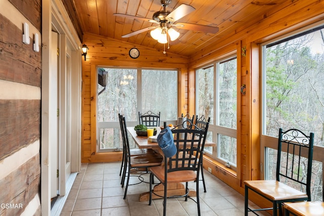 sunroom featuring vaulted ceiling, wood ceiling, and a ceiling fan