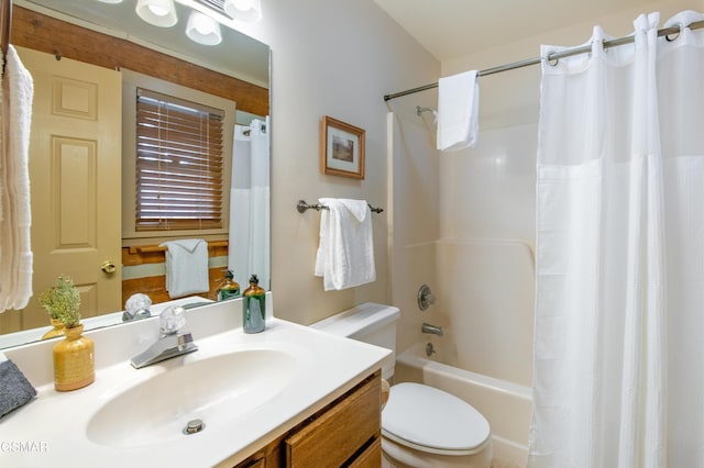 bathroom with shower / bath combination with curtain, vanity, and toilet