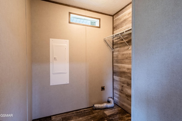 1138 Douglas Dam Rd, Dandridge, TN 37725 - laundry area featuring electric panel, electric dryer hookup, and wood finished floors
