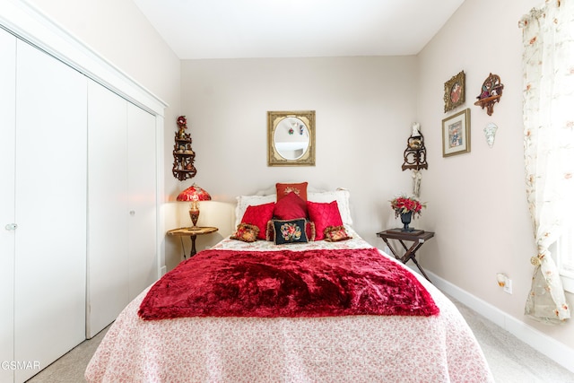 carpeted bedroom featuring a closet