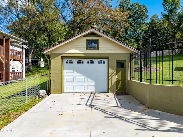 garage with a lawn