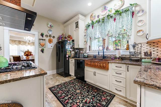 kitchen featuring black appliances, plenty of natural light, white cabinets, and extractor fan