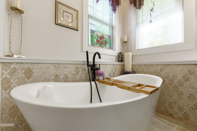 bathroom featuring a washtub