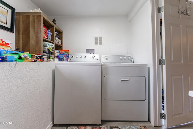 laundry room with washer and clothes dryer