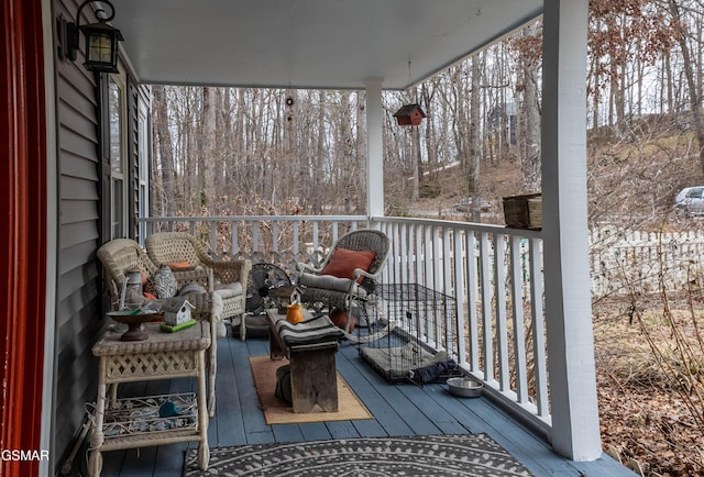 wooden deck featuring covered porch