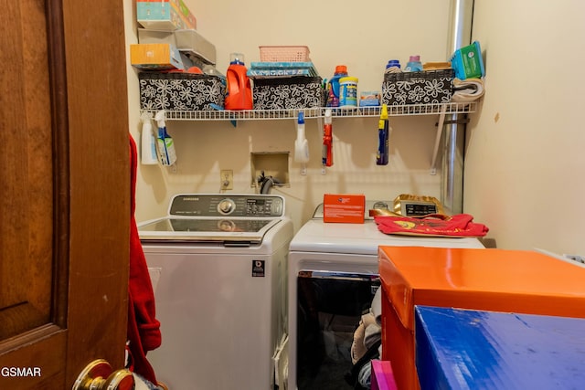 washroom featuring laundry area and washer and clothes dryer