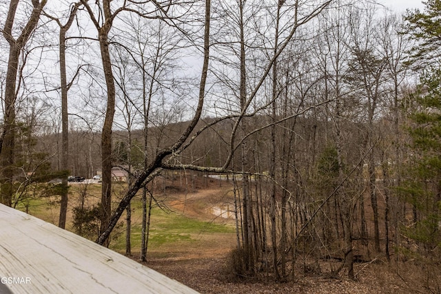 exterior space featuring a forest view