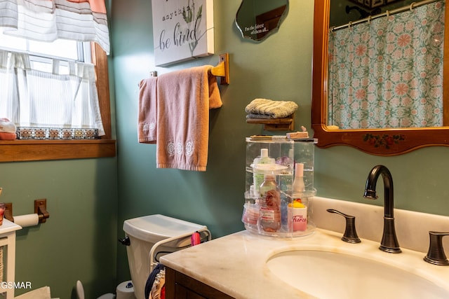 full bath with a shower with shower curtain and vanity