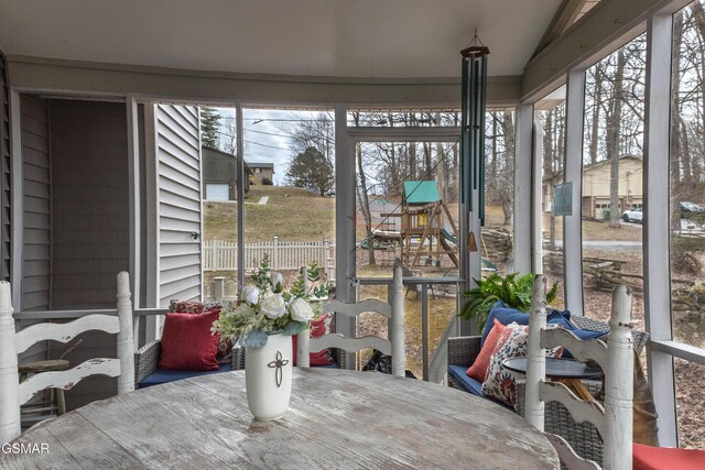 sunroom with lofted ceiling