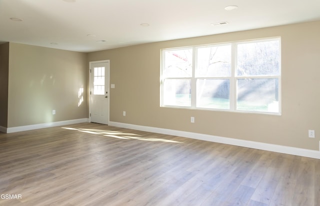 unfurnished room featuring light hardwood / wood-style floors