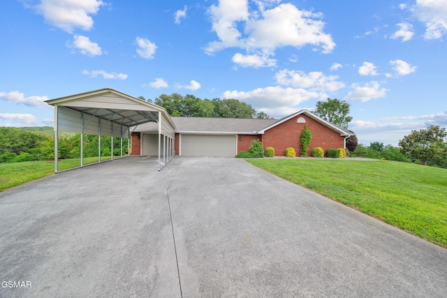 854 River Cliff Dr, Kodak, TN 37764 - view of front of property featuring a front yard, brick siding, a garage, concrete driveway, and a carport