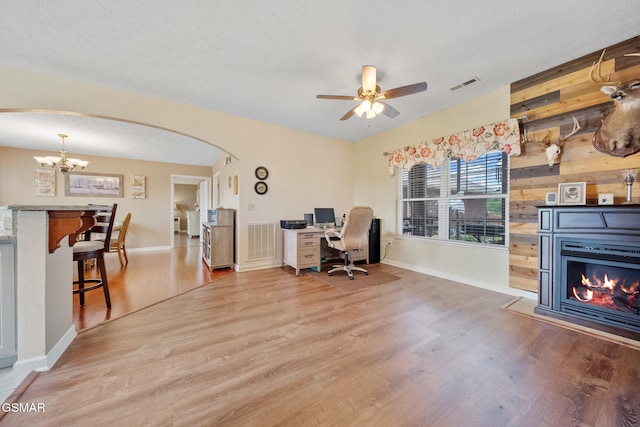 854 River Cliff Dr, Kodak, TN 37764 - office featuring arched walkways, light wood-type flooring, a chandelier, ceiling fan, and baseboards