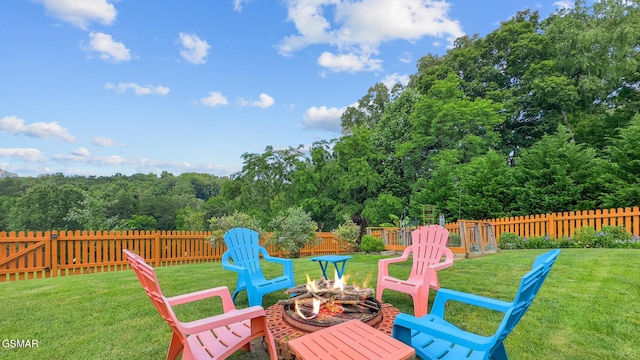 854 River Cliff Dr, Kodak, TN 37764 - deck featuring an outdoor fire pit and a view of trees