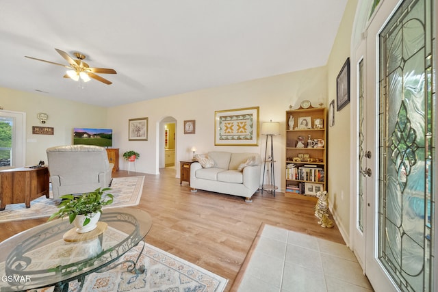 854 River Cliff Dr, Kodak, TN 37764 - living area featuring arched walkways, a ceiling fan, and light wood-style floors