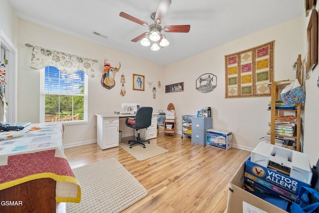 854 River Cliff Dr, Kodak, TN 37764 - office area featuring light wood-style flooring, a ceiling fan, and baseboards