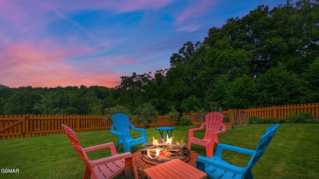 854 River Cliff Dr, Kodak, TN 37764 - patio terrace at dusk with a fire pit and a wooded view