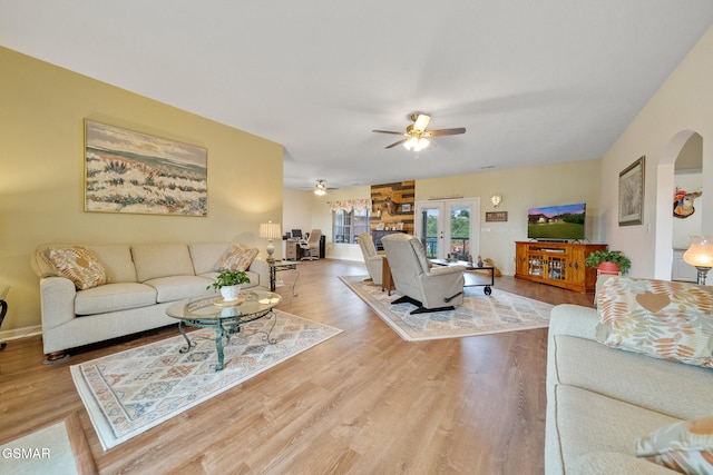 854 River Cliff Dr, Kodak, TN 37764 - living area with arched walkways, ceiling fan, wood finished floors, and french doors