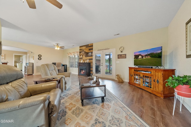 854 River Cliff Dr, Kodak, TN 37764 - living area featuring ceiling fan, wood finished floors, arched walkways, and baseboards