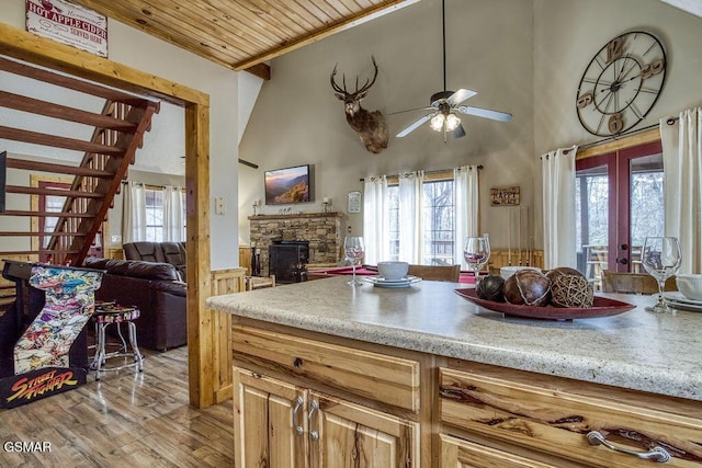 1785 Blue Ridge Rd, Sevierville, TN 37876 - kitchen with open floor plan, french doors, a stone fireplace, ceiling fan, and healthy amount of natural light