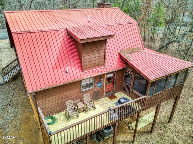 1785 Blue Ridge Rd, Sevierville, TN 37876 - back of property with a wooden deck, metal roof, a chimney, and central AC unit
