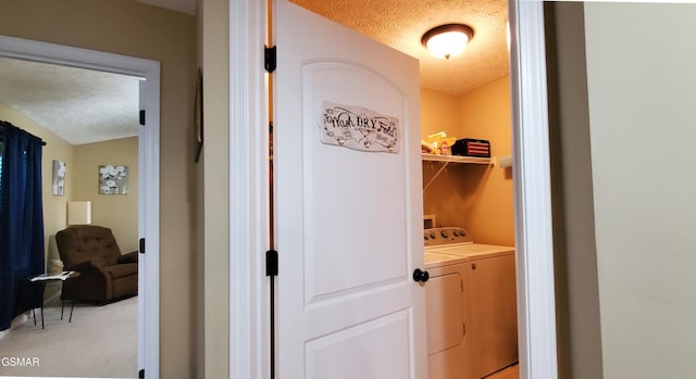 1003 Woullard Way Unit 1, Sevierville, TN 37876 - washroom featuring independent washer and dryer, a textured ceiling, and light carpet