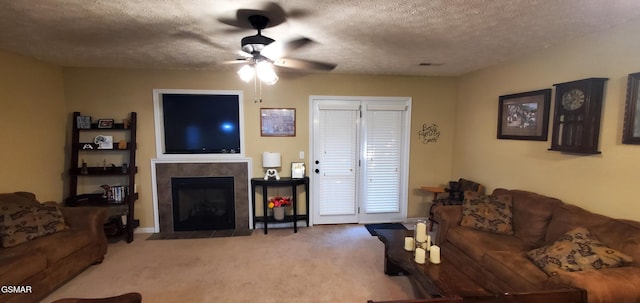 1003 Woullard Way Unit 1, Sevierville, TN 37876 - living room with a ceiling fan, carpet, a tile fireplace, and a textured ceiling