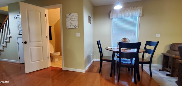 1003 Woullard Way Unit 1, Sevierville, TN 37876 - dining area featuring stairs and wood finished floors