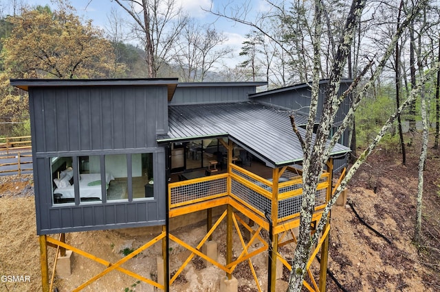 - Chinquapin Drive, Sevierville, TN 37862 - rear view of property with board and batten siding, fence, and metal roof