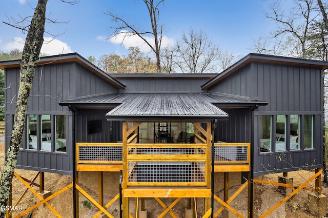 - Chinquapin Drive, Sevierville, TN 37862 - rear view of property featuring a wooden deck, board and batten siding, and metal roof