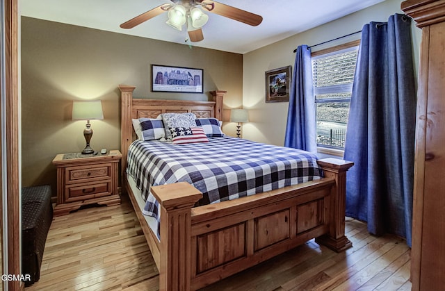 bedroom featuring a ceiling fan and light wood-type flooring