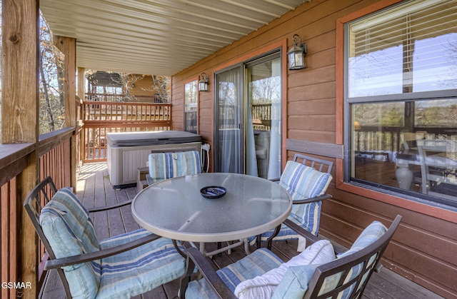 wooden terrace with outdoor dining area