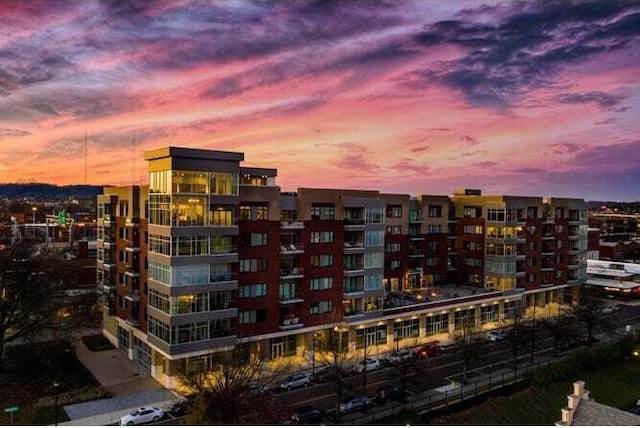 view of outdoor building at dusk